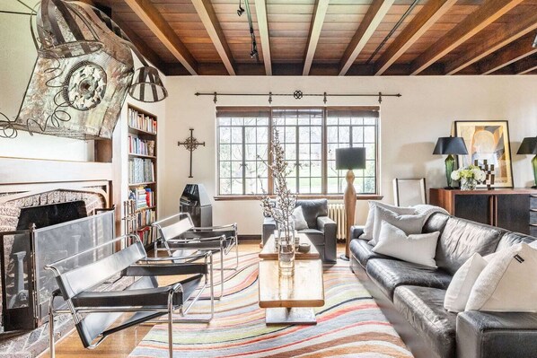 Living room with original walnut ceiling
