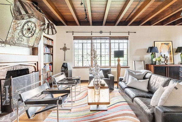 Living room with original walnut ceiling
