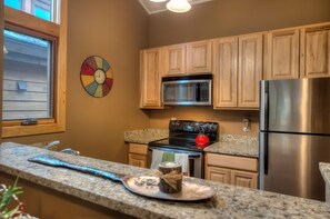 Kitchen with stainless steel appliances and granite countertops