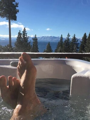 Kick back in the 7 person tub and enjoy the view winter or summer.