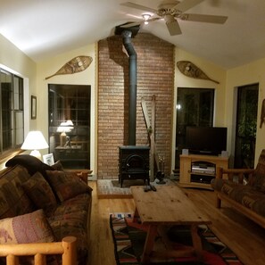 Family room - night view - great for movies, a winter fire, and sleeps four.