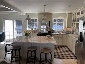 Open plan room into kitchen and outside back yard behind.