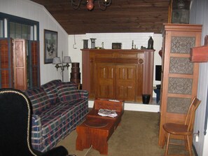 Cozy living room with gas fireplace, TV with cable and DVD player.