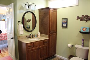 You can enter the bathroom from the bedroom or the kitchen.
