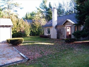 Front of  cabin, garage and parking area