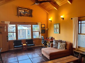 Light and airly livingroom with high beam ceilings.