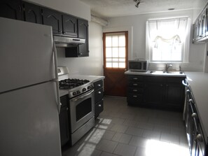 Fully Furnished Kitchen with gas store, microwave, coffee maker, dishwasher