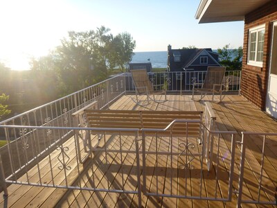 View of the lake from 2 decks in this 6BR Lake Shore Dr home, steps to the beach
