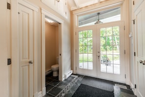 C'mon in ! Main entrance with powder room behind pocket door.