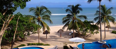 View from the Terrace of Casa O with beach and surfing out front! 
