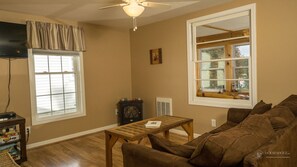 LIVING ROOM WITH ELECTRIC FIREPLACE AND QUEEN SLEEPER SOFA