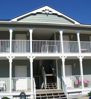 View from front of complex; entrance to this unit is second floor; center unit.