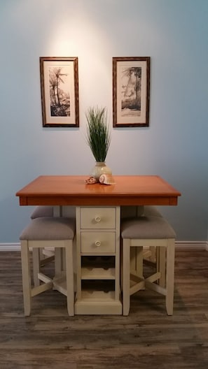 The dining room table seats 4, plus we have 3 bar stools in the kitchen.