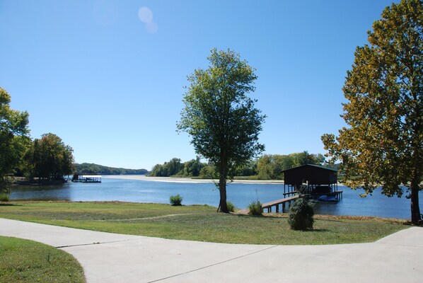 Level back yard with easy access to private boat dock, water, private boat ramp