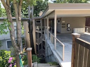 Covered parking at street level with 2 flights of covered stairs to your door