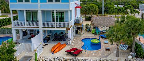 Aerial view - two kayaks, paddle boards, private pool & dock, loungers and more!