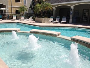 Enjoy this gorgeous heated pool! Fantastic Pool With Water Fountain & Palms. 