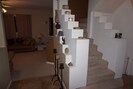Stairs from main floor to top level observation room that doubles as favorite BR
