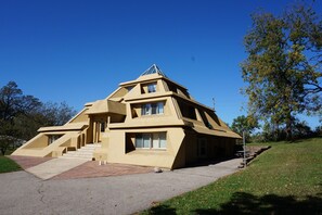 SE View of Pyramid House, former driveway & garage converted to BBQ Rec Rm Area.