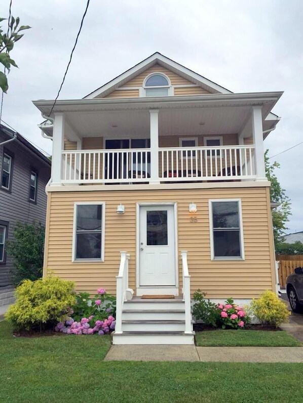 Front of House -view of deck. 2nd-3rd flr unit gets 2 off-street, driveway spots