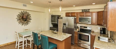 Gourmet Kitchen with Large Island, Granite Countertops and Stainless Appliances