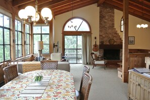 Great room facing the common space with a full view of Tomales Bay to the left