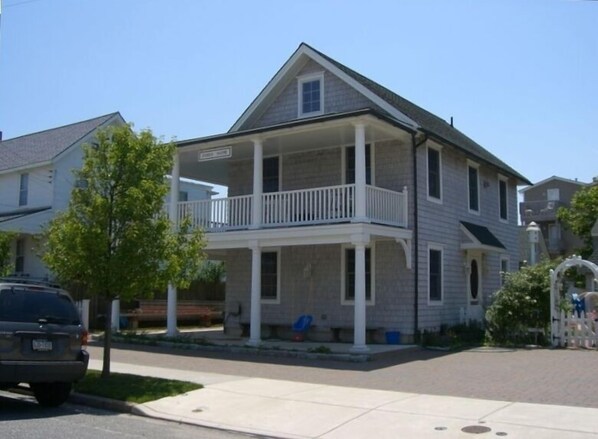 A dozen houses to beach, great 2nd floor porch with backyard grill and shower