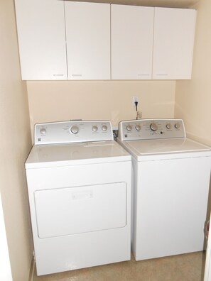 Full size washer & dryer - located in hallway