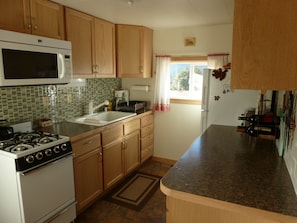 Bright, well-stocked kitchen