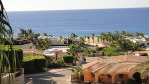 View of the beach from the patio. It is literally 100 yards away.
