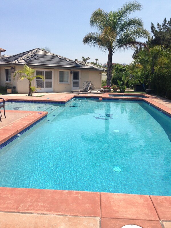 Gorgeous solar heated pool with view of guest house.
