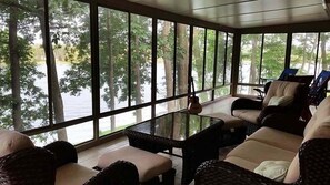 3-season room overlooks panoramic views of lake