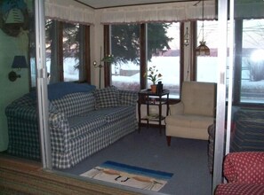 A cozy sunroom that has great view to lake with nice cross breezes!!