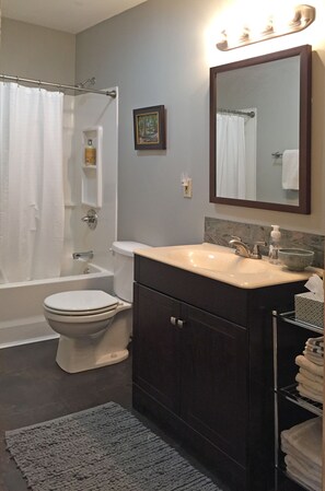 Two newly remodeled and well-lighted, full baths with tub/shower. 