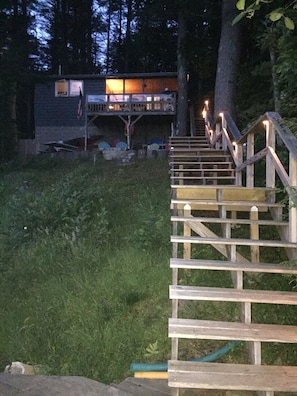 lighted stairs and pathway around house.  Both sides now have railings