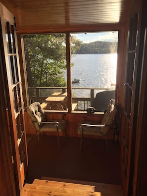 Sept, 2016.  View from living room thru porch/deck to lake
