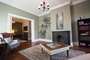 Enter the house through the parlour with original slate fireplace and mantle.