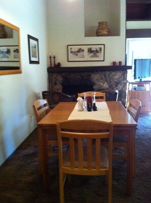 Dining at the top of the stairs, across from seating area