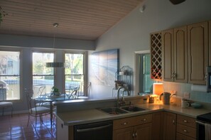 Seating at table for 6 with morning view of manatees and jumping mullet