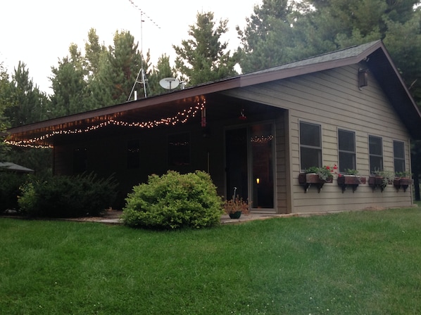 Cottage and patio.  See the smoke from the campfire?