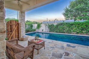 Covered lounge area and heated pool.