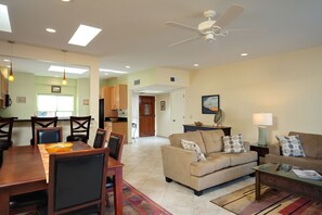 Living/dining room view looking toward kitchen and front entrance