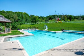 Massive double pool with water slide and water volleyball
