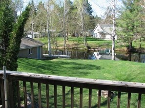 View from the deck of the backyard, water and dock.