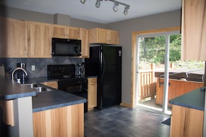 Kitchen with private hot tub & BBQ on the back deck