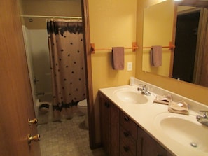 double sink separate from the shower/stool area.  Walk in closet adjacent