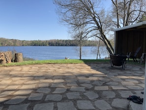 Back patio with fireplace watching the boats and animals pass by