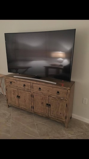 65" Curved Ultra HD TV with full premium cable, movie, sports channels, and WiFi