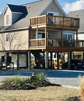Front of house faces Beach.  Back faces Wildlife Refuge. Two decks/ Parking