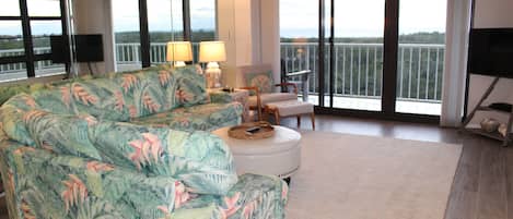 Spacious living room with Gulf Views and a 40' wrap-around balcony.